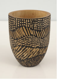 scorched and carved wooden bowl